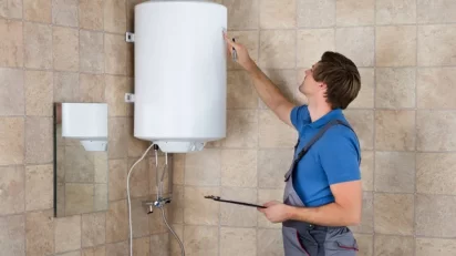 depositphotos_137860460-stock-photo-plumber-checking-electric-boiler